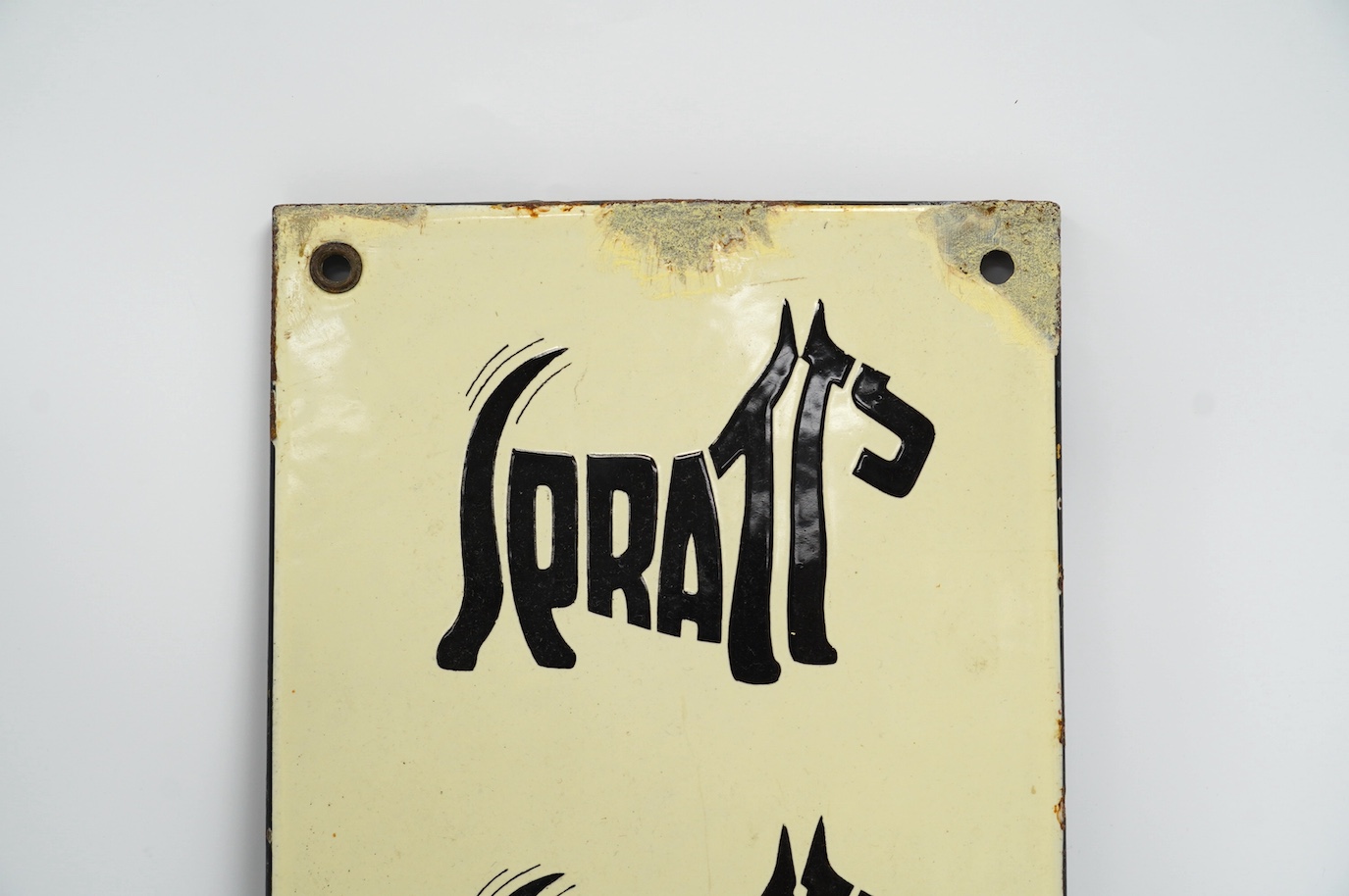 A vintage Spratt’s 'Five Terrier' enamel advertising sign, 18cm wide, 61cm high. Condition - fair